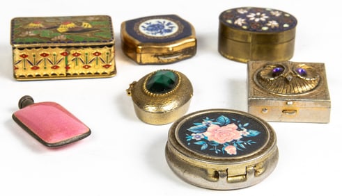 Six decorative metal pill boxes and a pink sterling silver and guilloche enamel scent bottle