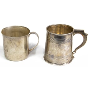 Two sterling mugs: a Tiffany child's cup with a band of soldiers and a Gorham cup