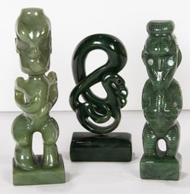 A group of Maori green stone carvings, two signed