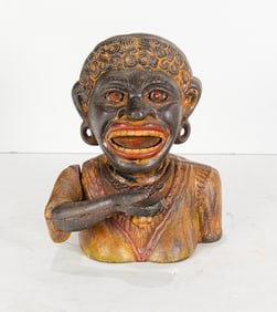 A painted cast iron figural mechanical bank: Dinah
