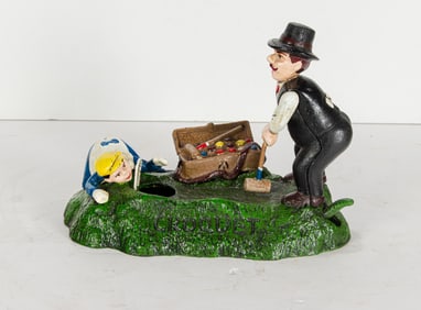 A Shephard Hardware painted cast iron mechanical 'Croquet' coin bank