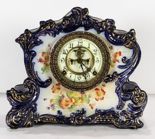 An Ansonia porcelain mantel clock in the 'Referee' pattern