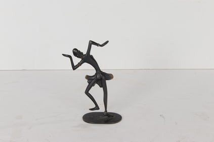 A Richard Rohac patinated and gilt bronze figure of an African dancer