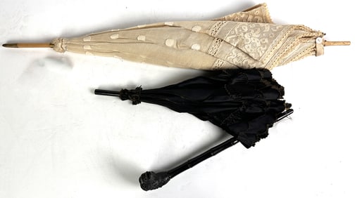 Two lady's lace parasols