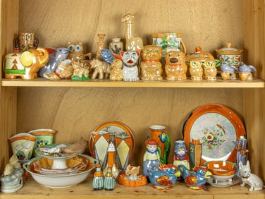 A group of approximately forty-six mainly Japanese porcelain lusterware figures and table articles