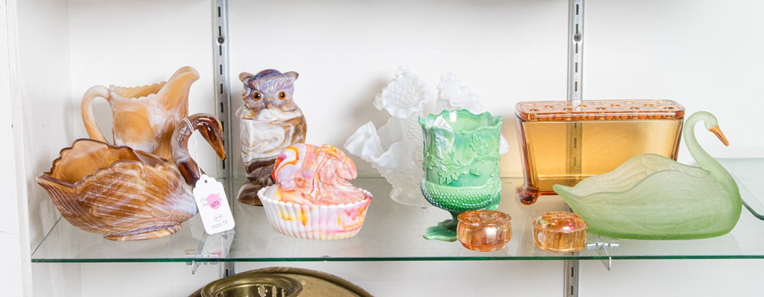 A group of molded slag glass and uranium glass, including Imperial Glass, Westmoorland, and Mosser: A group of mainly molded slag glass, including group of Imperial Glass, including swan, owl candy jar and windmill pitcher; Westmooreland rabbit on basket; Mosser acron spooner; hobnail epergne; Urani