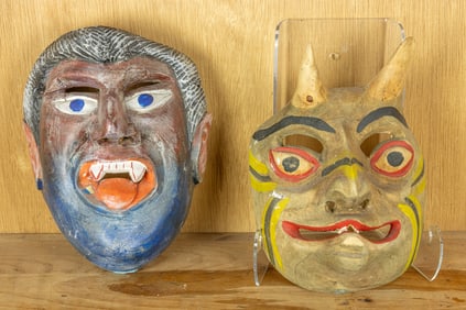 Two carved and painted wood masks
