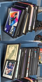 A group of approximately forty-nine Merl Saunders and other music memorabilia in black frames