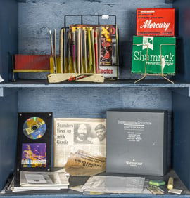 An assembled group of Merl Saunders and other music memorabilia and display stands