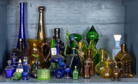 A collection of glass bottles and decanters