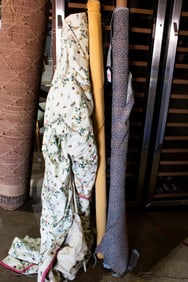 Two bolts of fabric and a shade