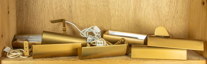 A group of nine burnished gilt picture lights