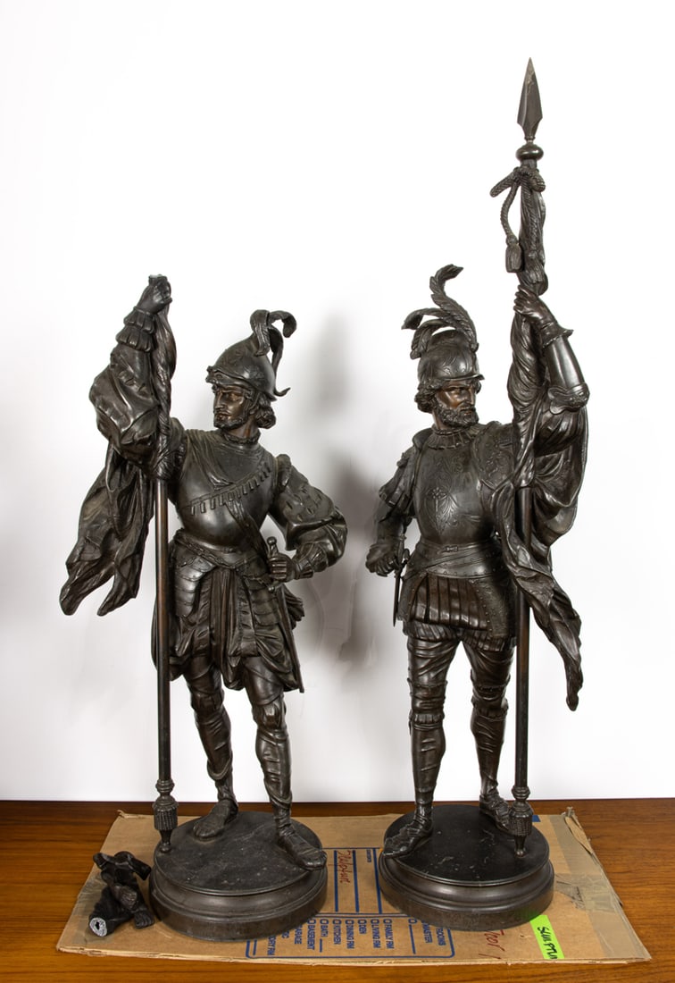 A pair of Renaissance Revival patinated metal figures of knights: A pair of Renaissance Revival patinated metal figures of knights, (one broken), greatest 41.5"h