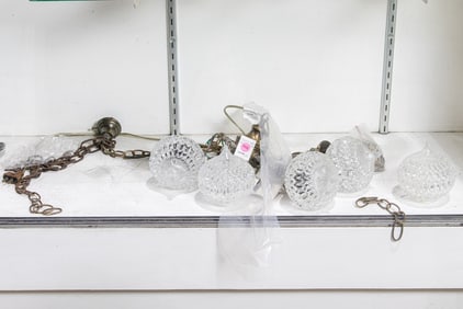 A Mid-Century Modern brass and glass five light fixture