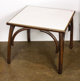 A Mid-Century Modern bentwood occassional table with laminate top