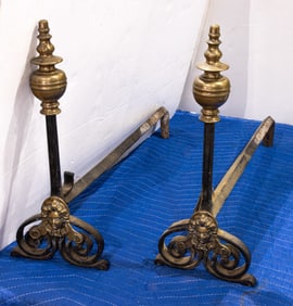 A pair of Baroque bronze and iron chenets /andirons