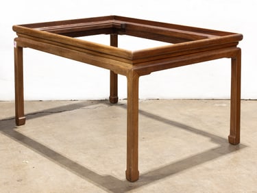 An Asian style hardwood dining table with glass inset top