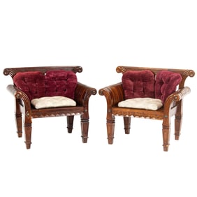 A pair of Indonesian metal mounted carved hardwood armchairs