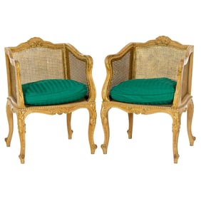 A pair of Louis XV style caned bergeres