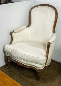 A Louis XV style upholstered armchair