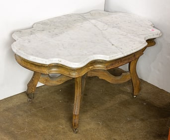A Victorian style coffee table with marble top