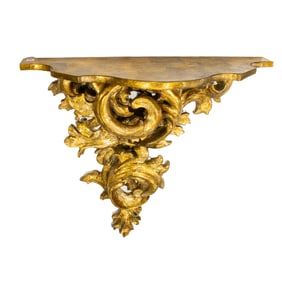 A Rococo style giltwood wall console table