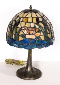 An Arts & Crafts style leaded glass and patinated table lamp