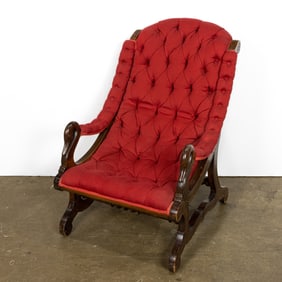 An Empire style mahogany and upholstered armchair