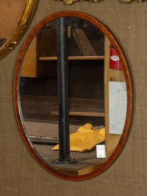 A Classical style mahogany and satinwood string inlaid oval wall mirror