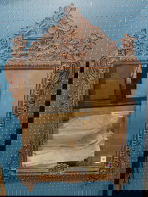 A Spanish Baroque style oak mirror