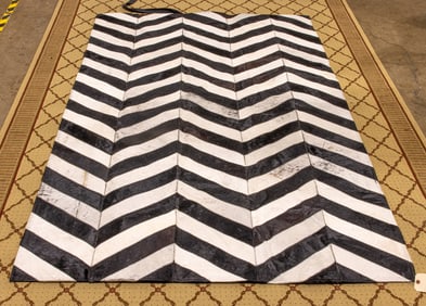 A Contemporary Kravet Modern Luxe cowhide carpet in a chevron design