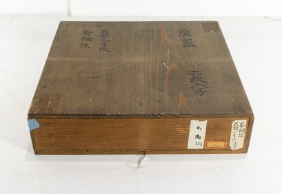 A Japanese black and gilt lacquer tray with family crest