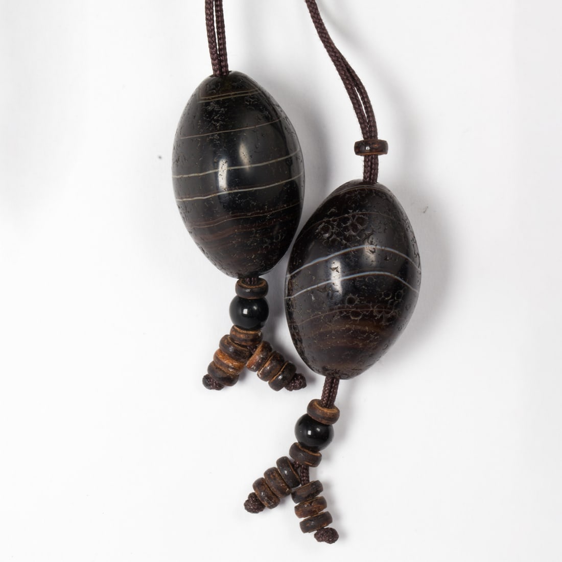 (lot of 2) Chinese archaic agate beads: (lot of 2) Chinese archaic agate beads. 1.25" across.