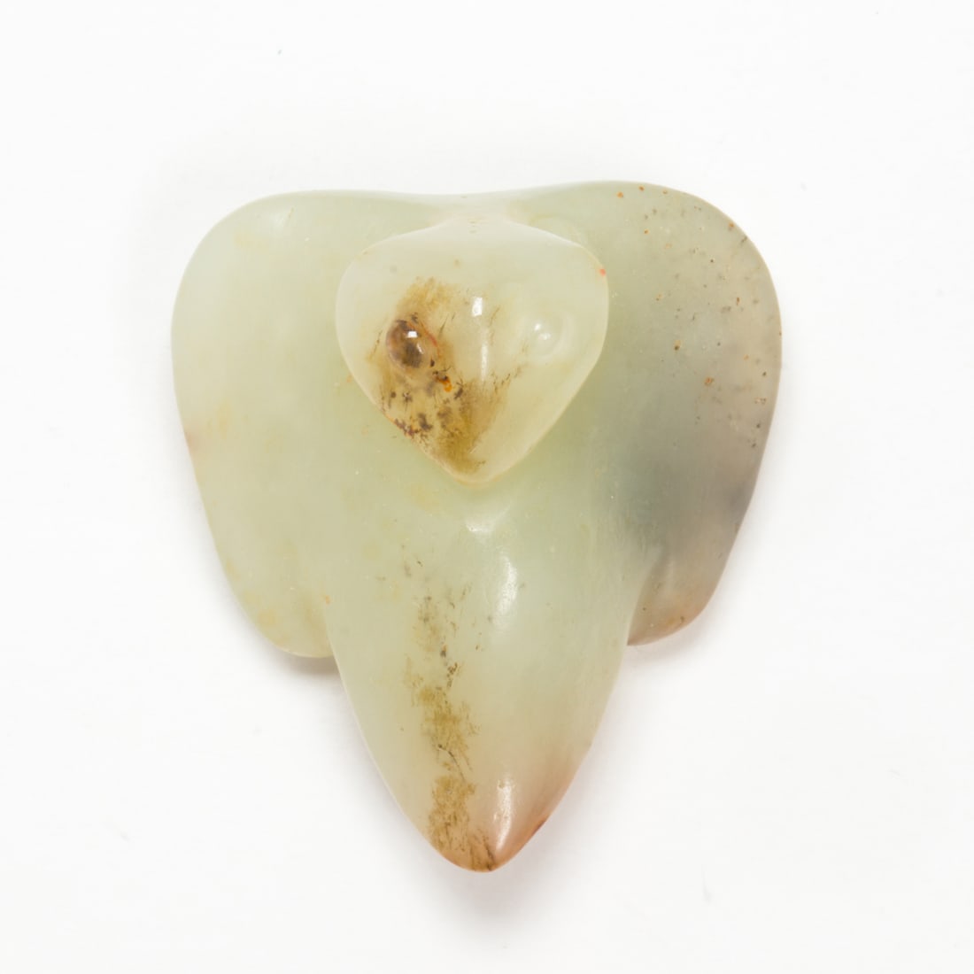 A Chinese russet and celadon jade bird toggle: A Chinese russet and celadon jade bird toggle. 1.25" across.