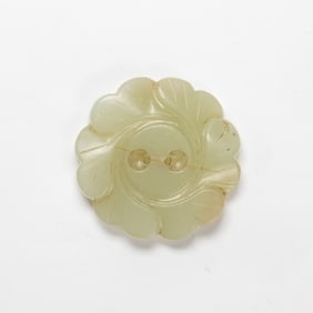 A Chinese celadon jade flower button