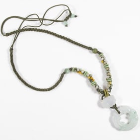 A Chinese jadeite circular pendant