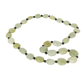 A Chinese celadon jade pebble necklace