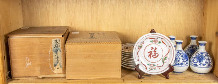 A shelf of Japanese porcelain items