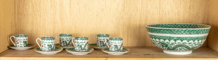 A shelf of Chinese famille verte dragon articles