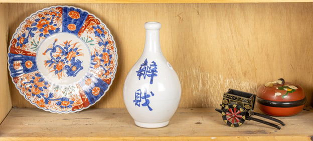 A shelf of Japanese decorative objects