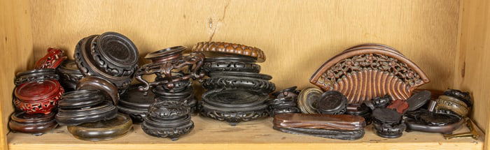 A shelf of Chinese wood stands