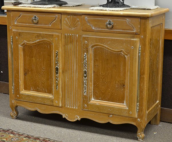 French Provincial style buffet: French Provincial style buffet, executed in white washed oak, the rectangular top above a panelled two door case retaining original hardware and rising on cabriole legs, 42""h x 55""w x 22""d (with ke