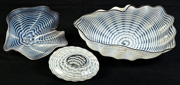 Glass Seafoam forms, Dale Chihuly: (Set of three) White, clear and black rimmed glass Seafoam forms, 1994, by Dale Chihuly (American, b. 1941), signed and dated ""Chihuly 94"" bottom, overalls (largest to smallest): 4""h x 8.25""w x 4.