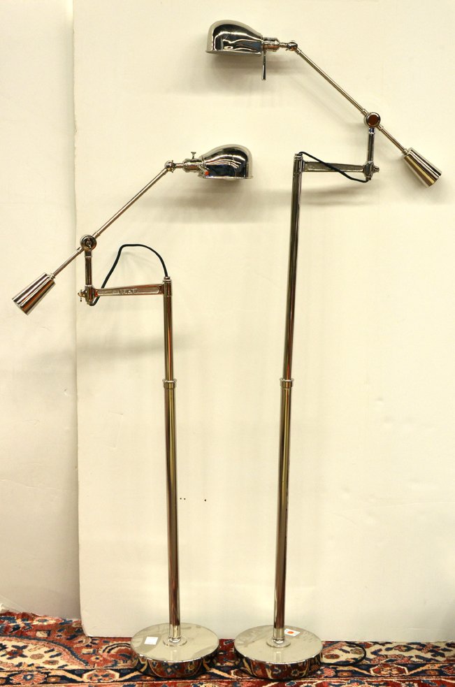 Pair of Mid Century chrome floor lamps: Pair of Mid Century chrome floor lamps, each adjustable fixture with a cantilevered single light rising on a telescoping tubular standard terminating at the circular base, 70""h x 29""w (extended)