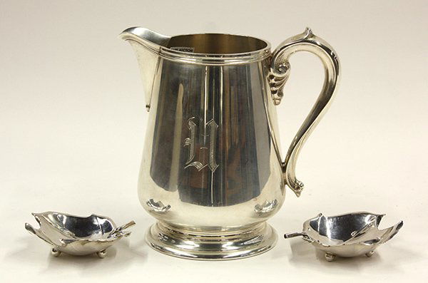 American sterling silver table accessories: (lot of 3) American sterling silver table accessories consisting of a reproduction Benjamin Faneuil water pitcher by Richard Dimes, 1908-1955, bearing a calligraphic H monogram; together with two leaf