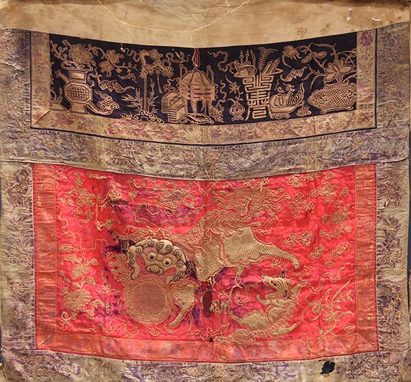 Chinese Altar Frontist Hanging: Chinese altar frontist piece, late Qing/early Republic period, couched with a large fu-lion clutching a brocade ball along with a smaller cub to the right, amid floral sprigs on a satin red ground, be