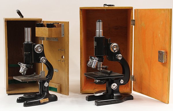 Microscopes: (lot of 2) Bausch & Lomb Optical Company laboratory microscope with box, 12""h, and Spencer Buffalo laboratory microscope model number 163577, with a pine locking box, 13.5""h
