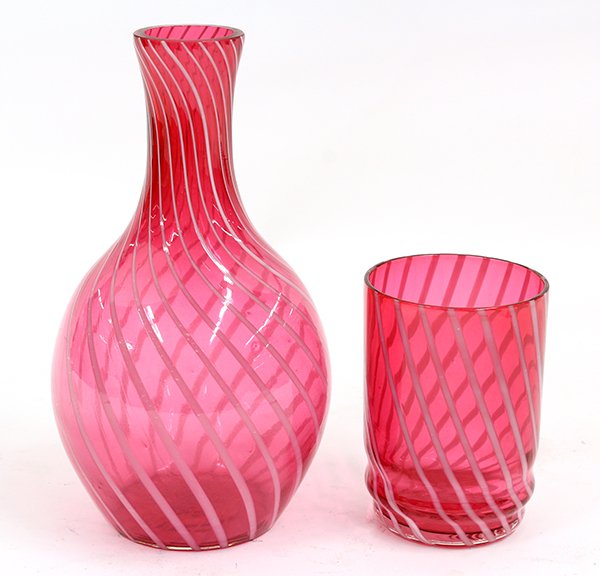 Victorian style cranberry glass table accessories: (lot of 2) Victorian style cranberry glass table accessories including a tumbler and vase, decorated with a frosted swirl pattern tallest: 7.5""h