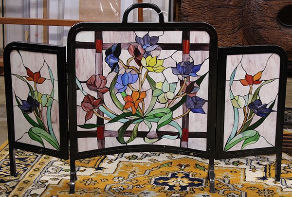 Arts and Crafts style leaded glass firescreen: Arts and Crafts style leaded glass firescreen, the three panel screen having a metal surround centered by the leaded glass panels depicting floral sprays, and rising on outswept legs, 32""h x 42""w