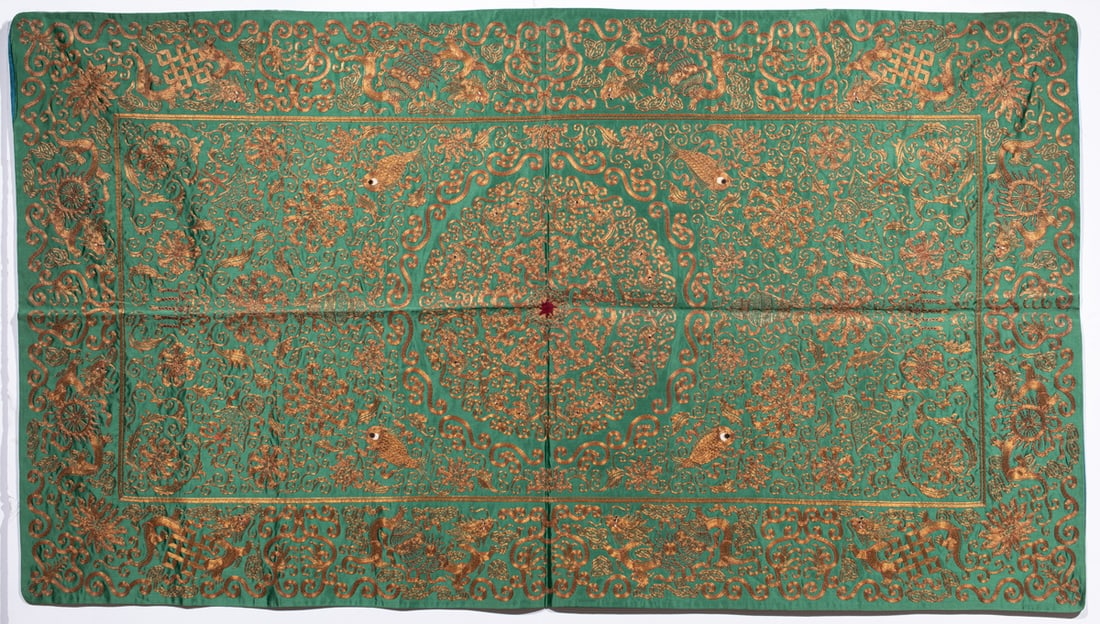 A Chinese green-ground silk and gilt thread embroidered panel (1 of 4)